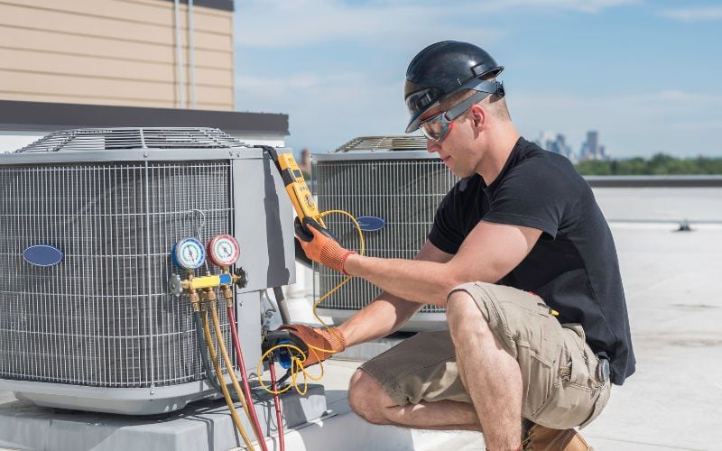 HVAC professional checking a unit